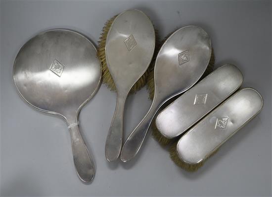 A 1930s engine turned silver five piece mirror and brush set, Barker Brothers Silver Ltd, Birmingham, 1936/8.